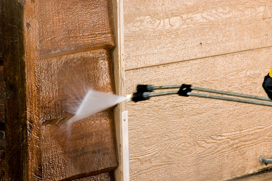 Washing The Garage The side of a garage being pressure washed ** Note: Slight blurriness, best at smaller sizes